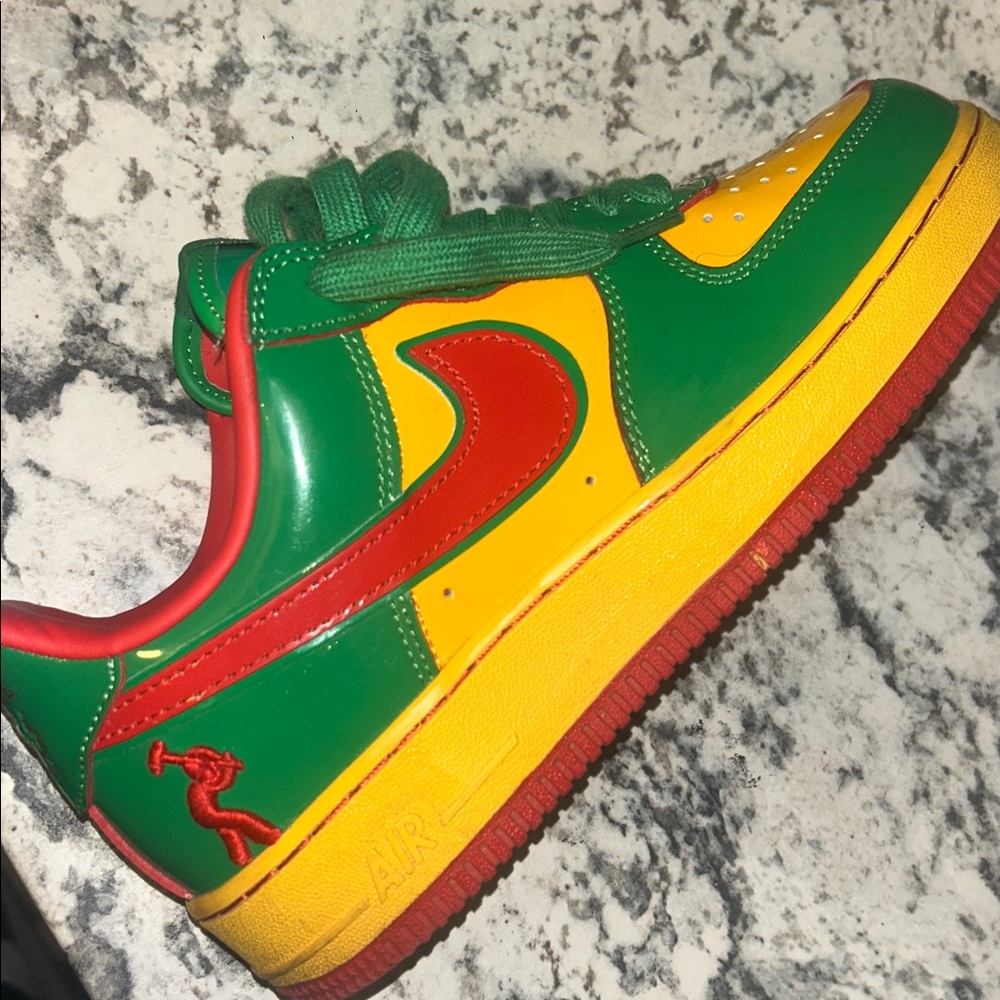 Nike Green, Yellow, and Red Sneakers concrete Air Force ones
